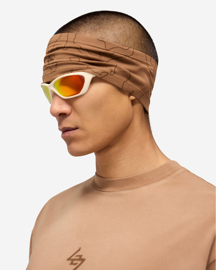 Product image of a mens rust headband on a plain white background | 247 Contour Headband in Rust | Reflective running headband | 247 Accessories | Represent Clo