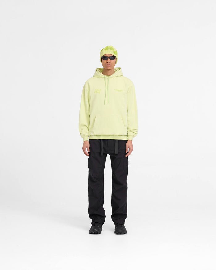 Man wearing an oversized lime hoodie on a plain white background | 247 Future Terrains Oversized Hoodie in Shadow Lime | Training hoodie with tonal branding | 247 Hoodies | Represent Clo