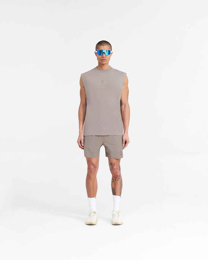 Man wearing a grey oversized tank top on a plain white background | 247 Oversized Tank in Cinder | Lightweight tank with 4-way stretch fabric | 247 T-Shirts | Represent Clo