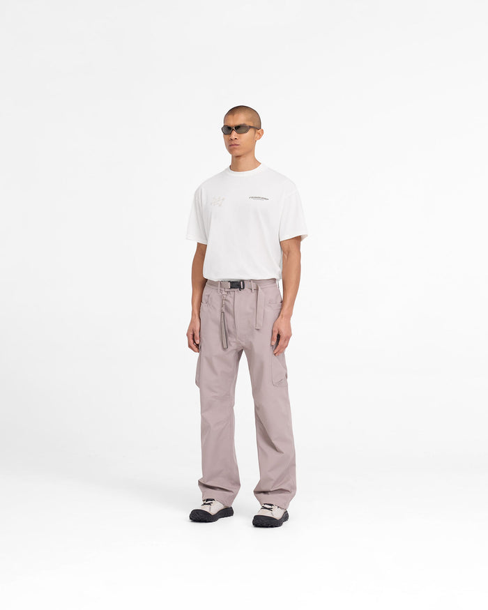 Man wearing grey cargo pants on a plain white background | 247 Technical Cargo Pant in Moonrock | Straight leg waterproof technical cargo pants | 247 Pants | Represent Clo