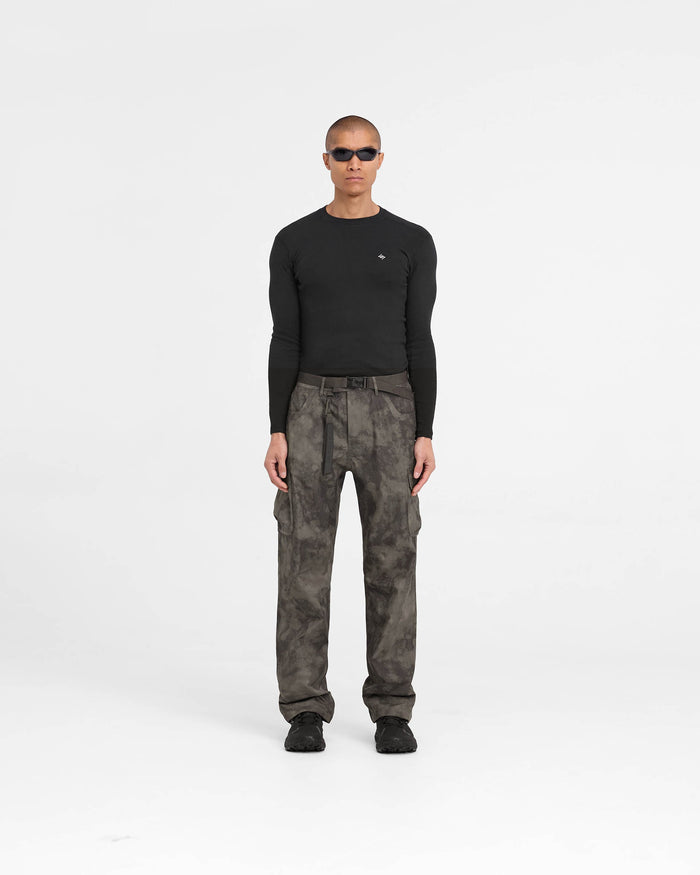 Man wearing tan cargo pants on a plain white background | 247 Technical Cargo Pant in Terrain | Straight leg waterproof cargo pants with technical pockets | 247 Pants | Represent Clo