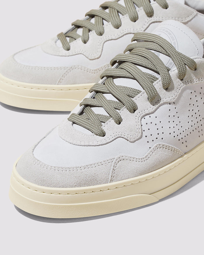 Back angle of white and green sneakers