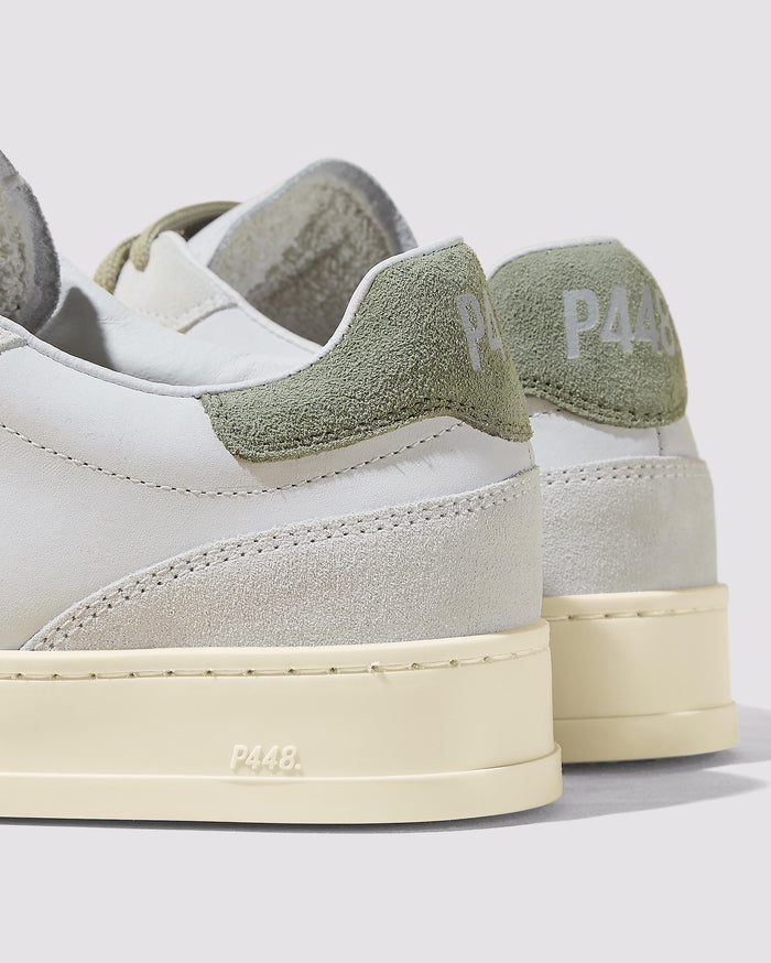 Side angle of white and green sneakers
