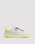 Side angle of beige and yellow sneakers