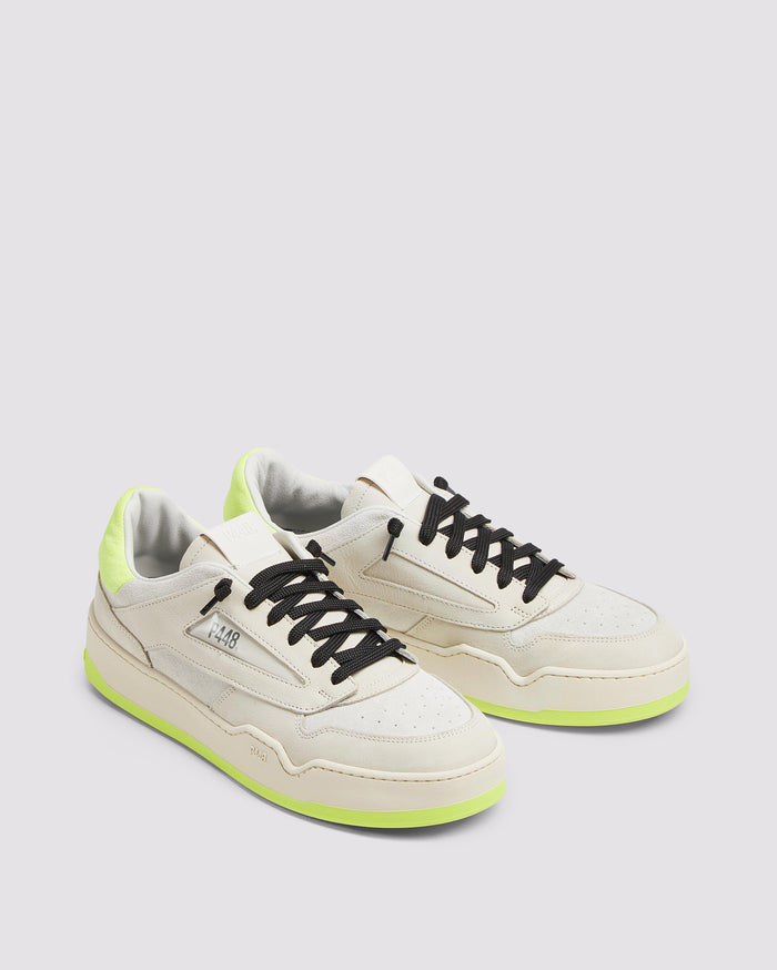 Back angle of beige and yellow sneakers