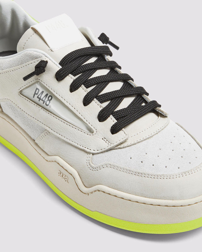 Side angle of beige and yellow sneakers