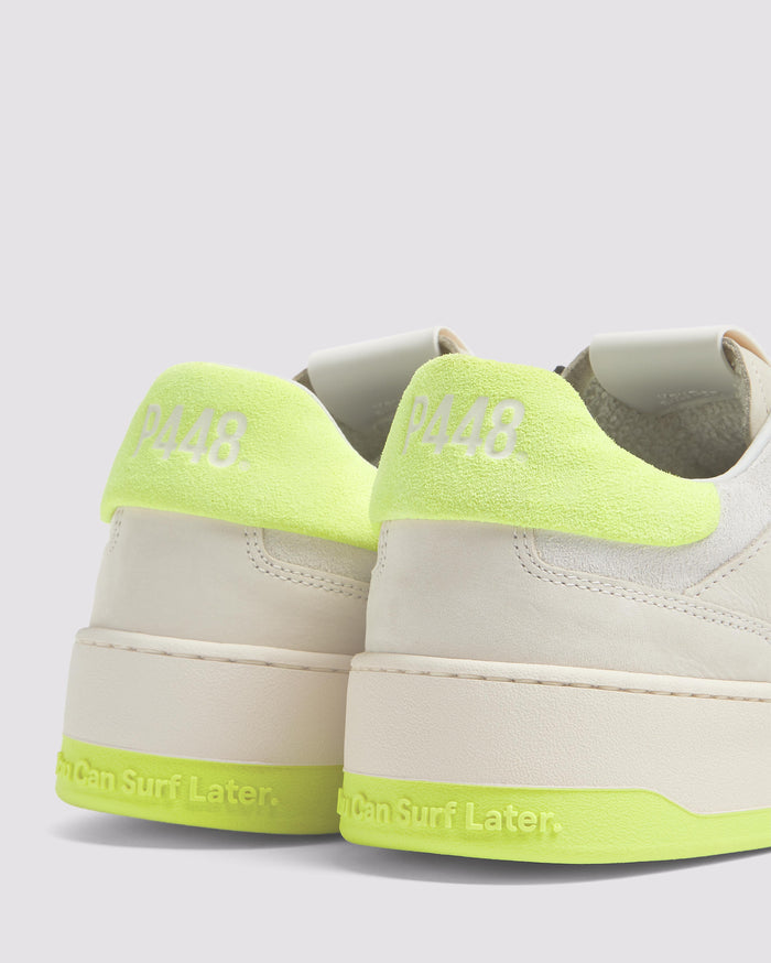 Side angle of beige and yellow sneakers