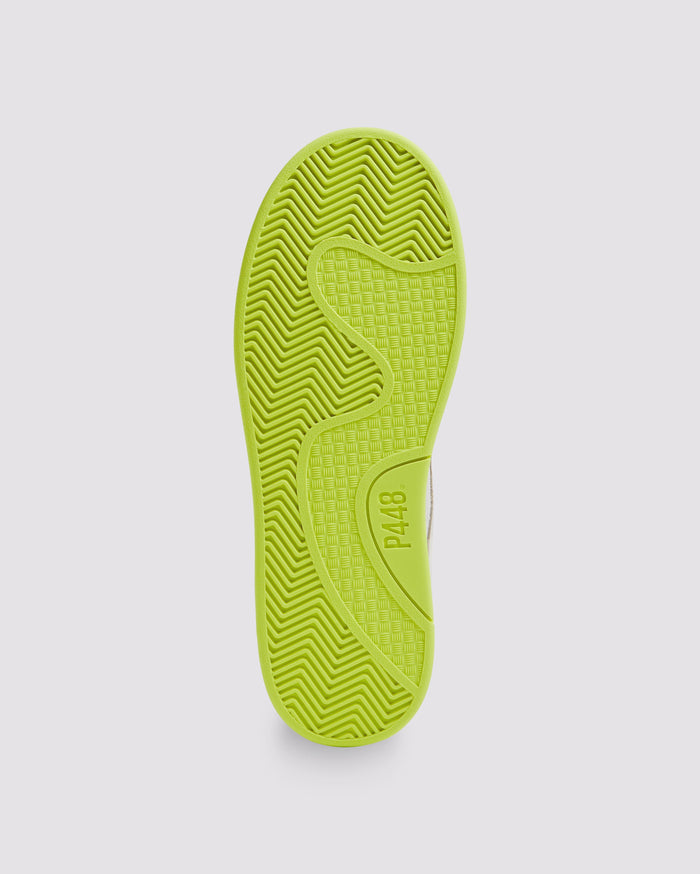 Bottom angle of beige and yellow sneakers
