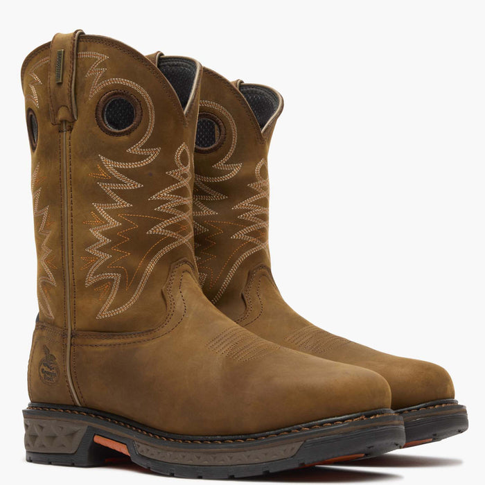 Pair of brown leather boots with intricate stitching on a white background
