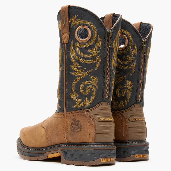 Pair of brown and black boots with intricate design on a white background