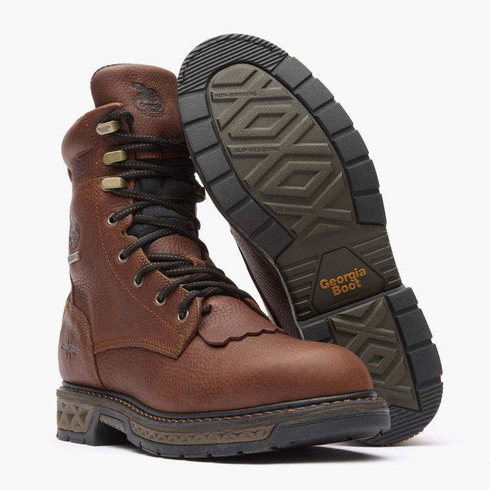 Brown boot with black sole on a white background