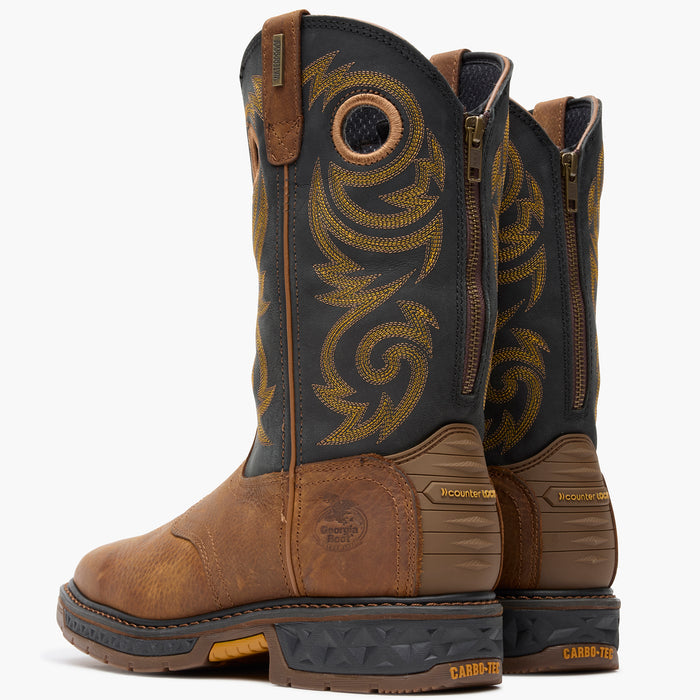 Pair of brown and black boots with intricate design on a white background