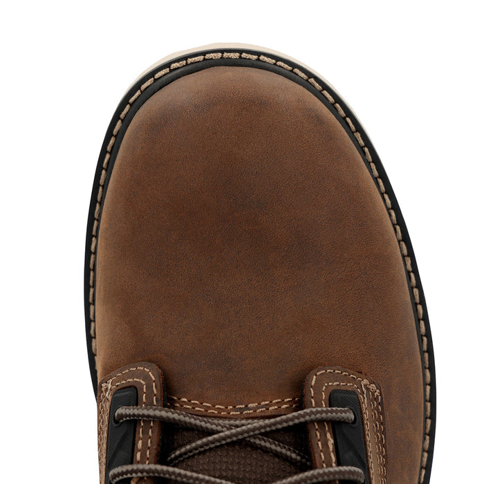 Close-up of a brown leather boot with visible stitching on a white background