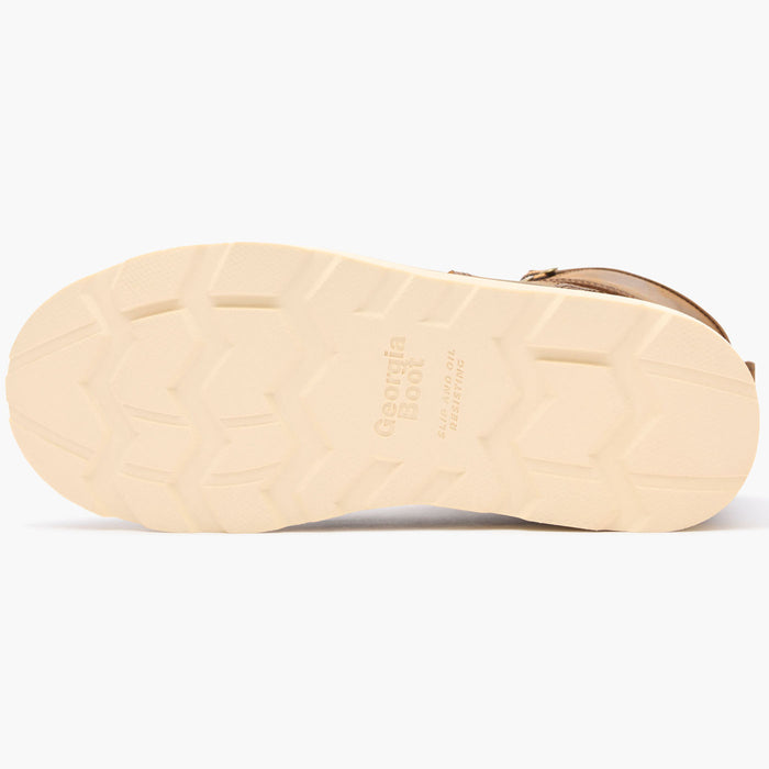 Close-up of a beige shoe sole with brand name on a white background