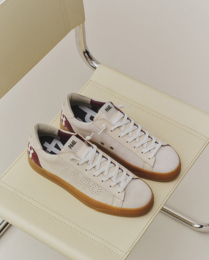 Back angle ofbeige with burgundy laces sneakers