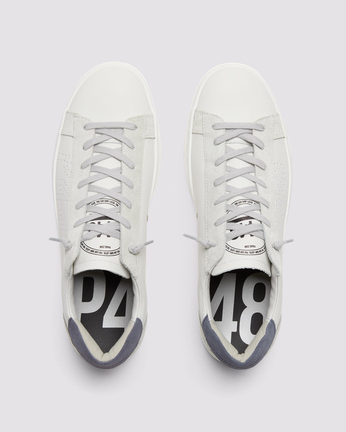 Front angle of white and blue sneakers