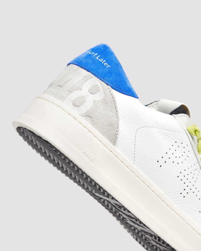 Side angle of white and blue sneakers