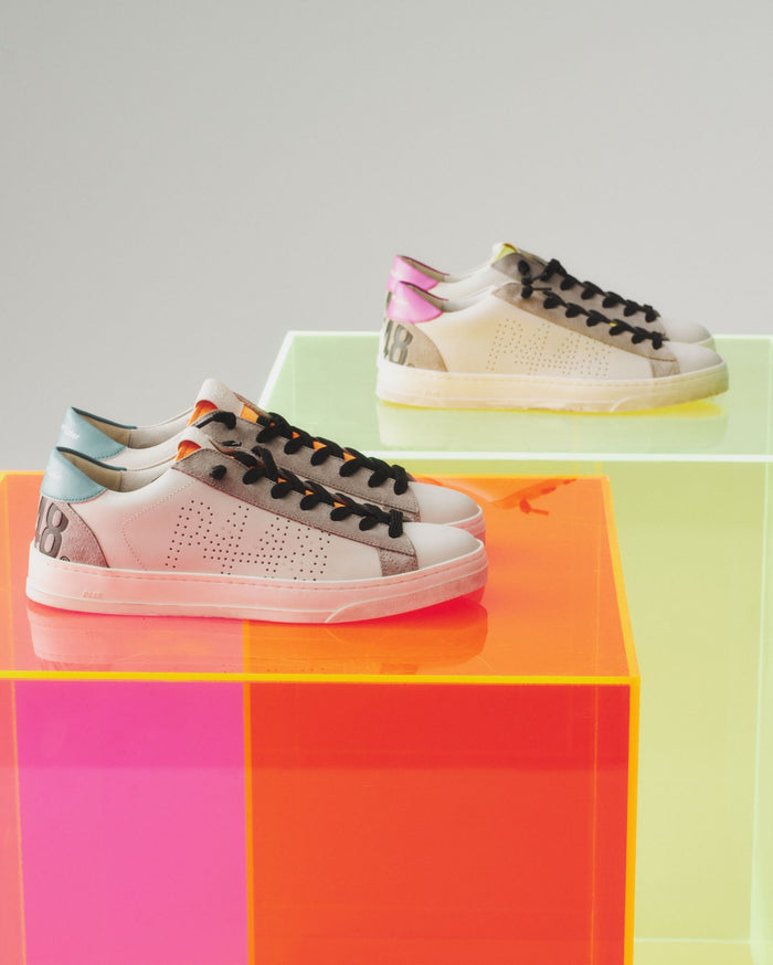 Front angle of white, pink and yellowsneakers