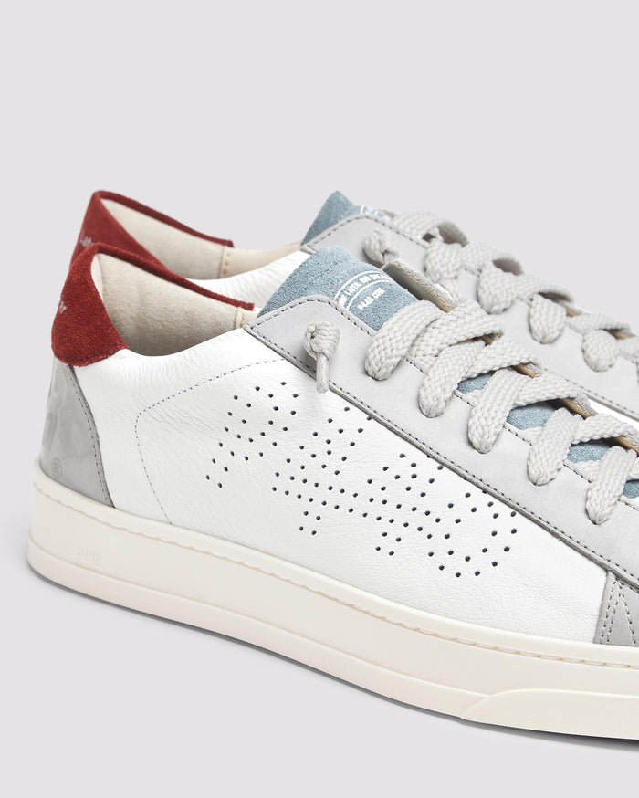 Side angle of white, burgundy and blue sneakers