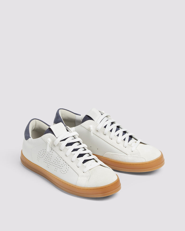 Back angle of white and navy sneakers
