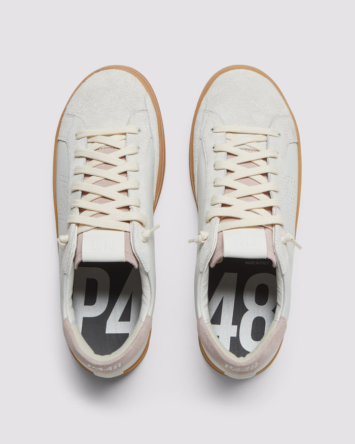 Front angle of white/pink sneakers