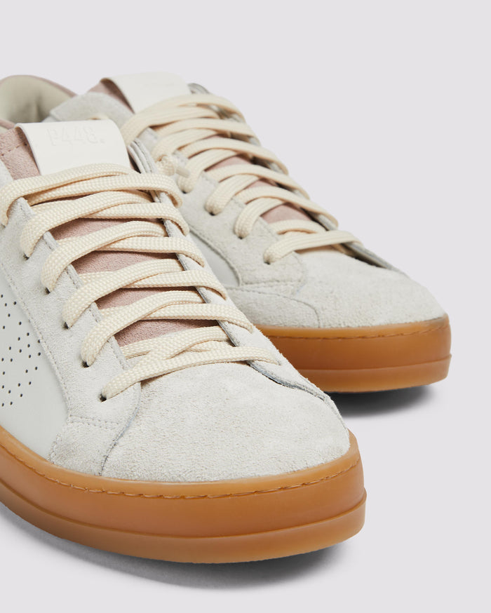Side angle of white/pink sneakers