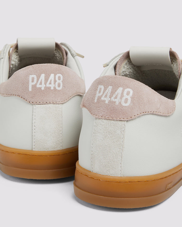 Side angle of white/pink sneakers