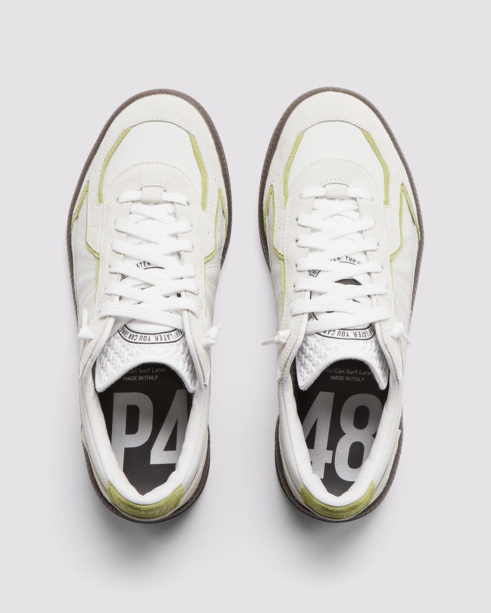 Front angle of green and white sneakers