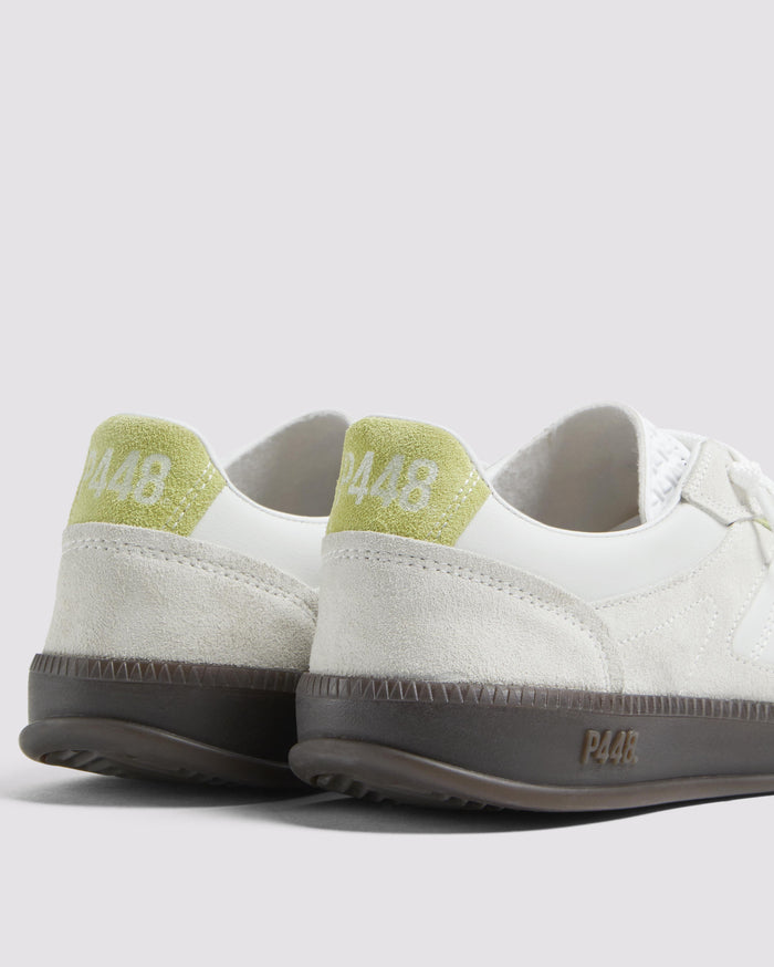 Side angle of green and white sneakers