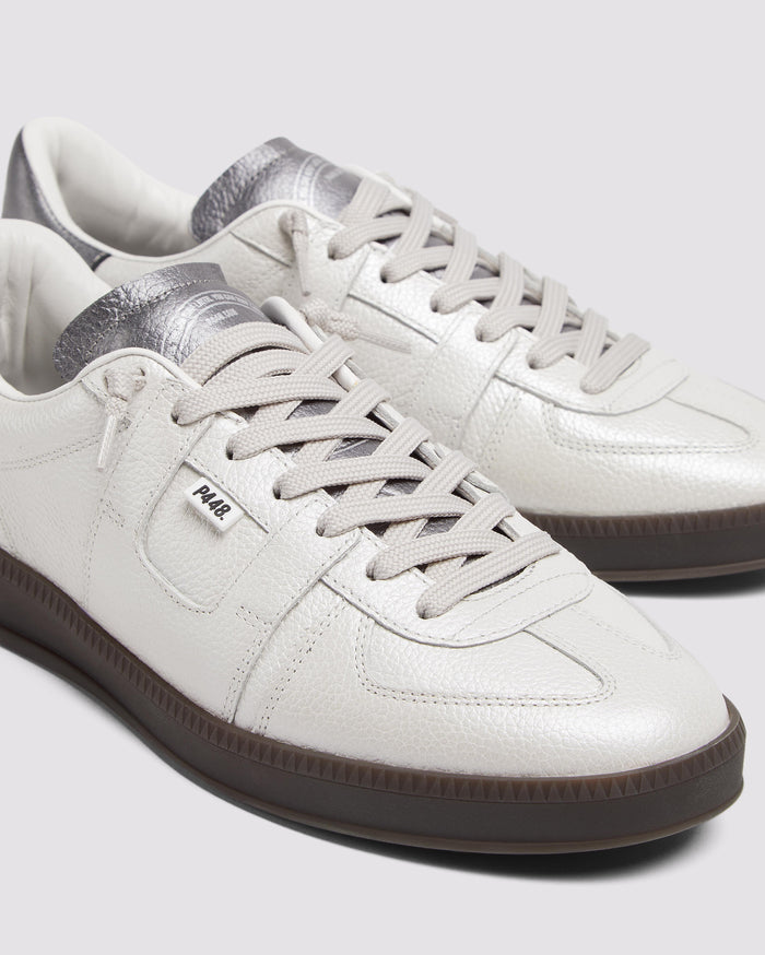 Side angle of white sneakers