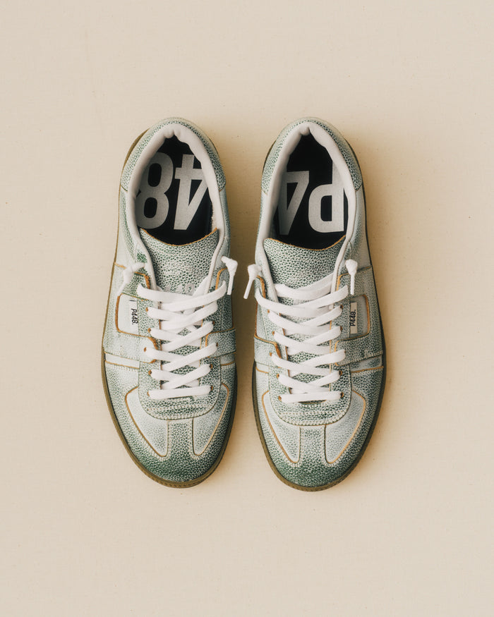 Front angle of green sneakers