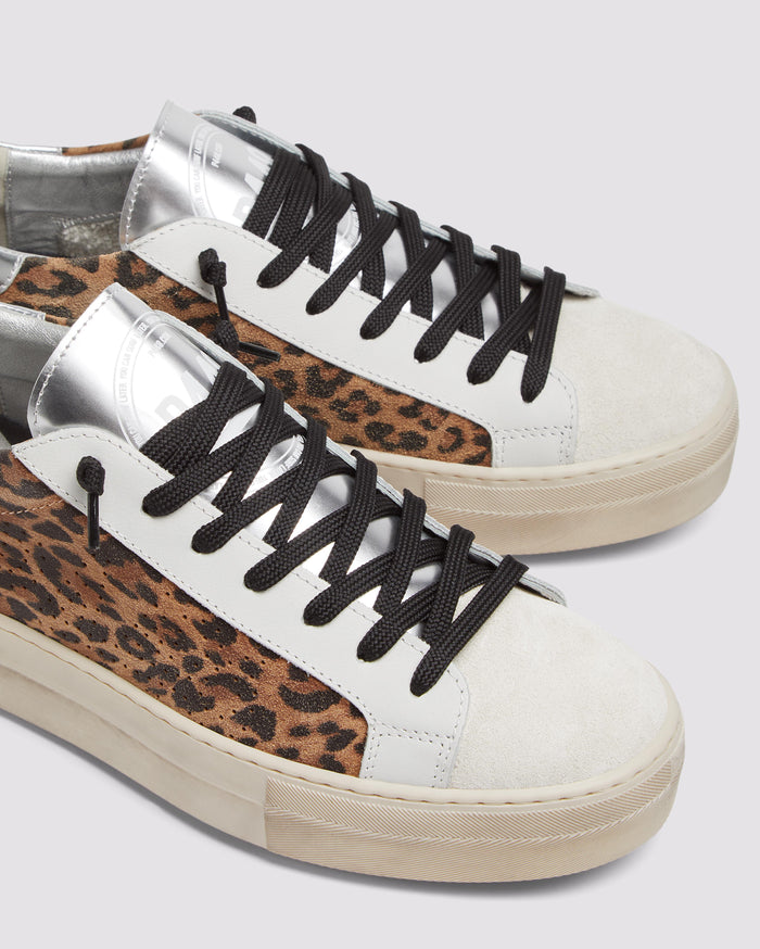 Side angle of black and brown leopard and silver platform sneakers