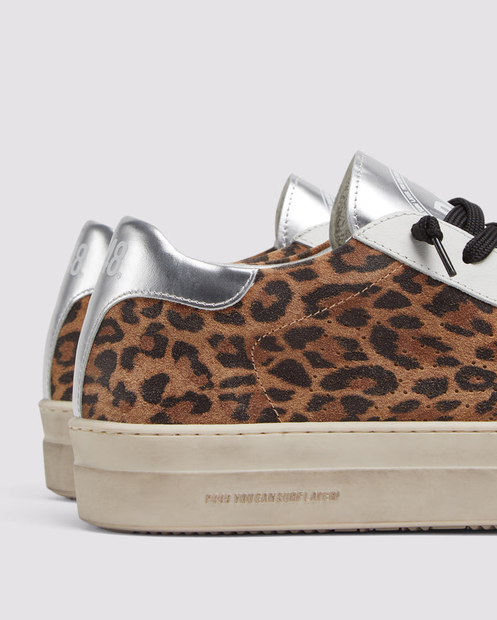 Side angle of black and brown leopard and silver platform sneakers