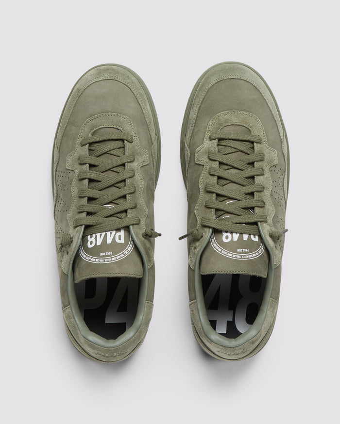 Back angle of green sneakers
