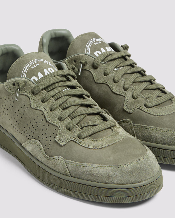 Side angle of green sneakers