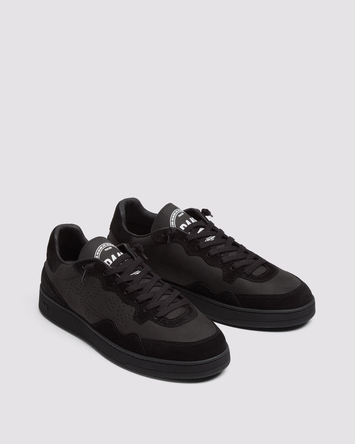 Back angle of black sneakers