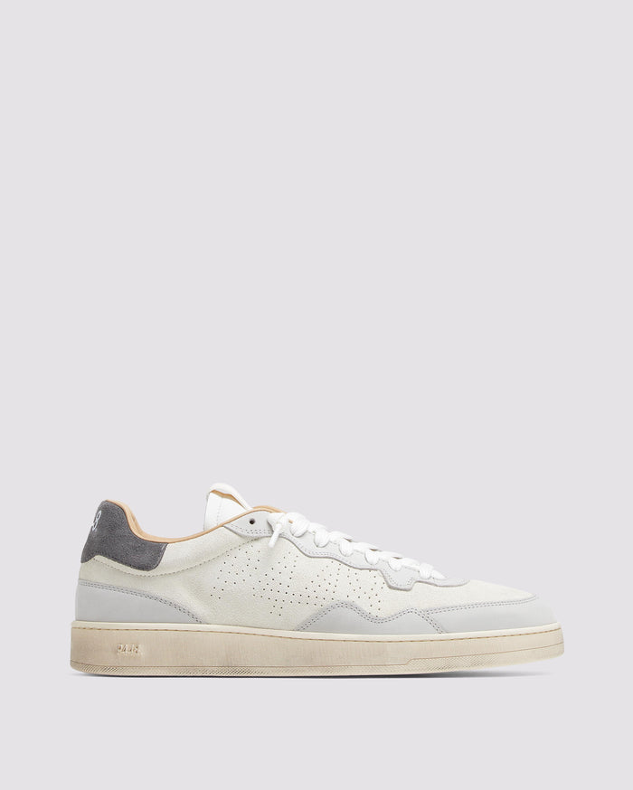 Side angle of white and grey sneakers