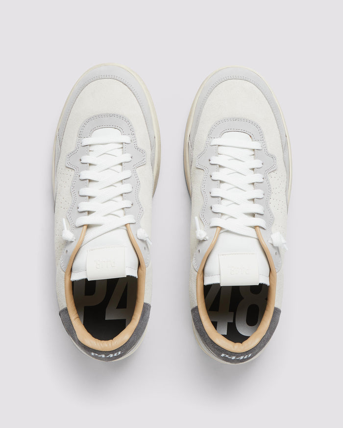 Front angle of white and grey sneakers