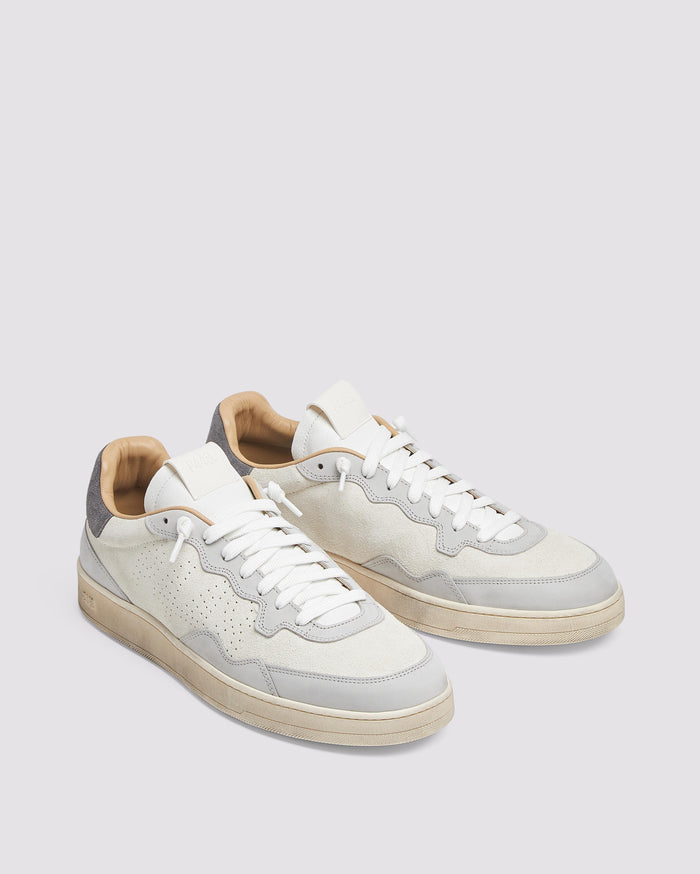 Back angle of white and grey sneakers