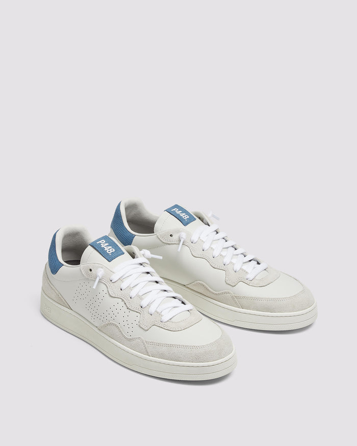 Back angle of white/blue sneakers