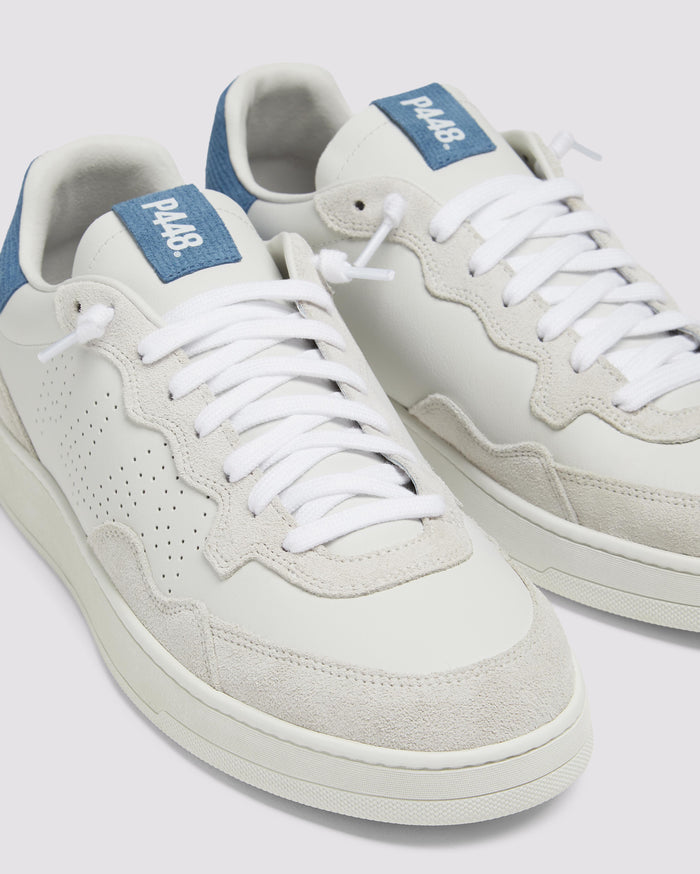 Side angle of white/blue sneakers