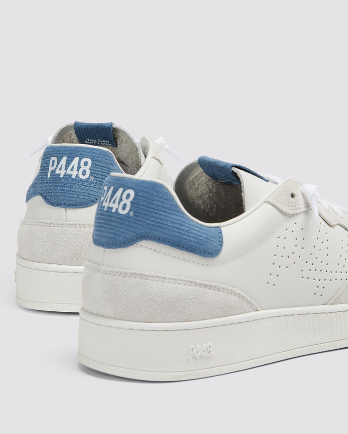 Side angle of white/blue sneakers